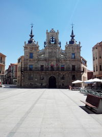 View of buildings against blue sky