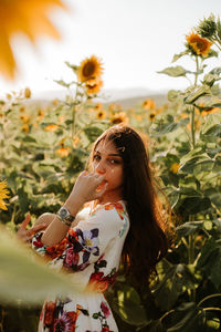 Young woman looking at plants