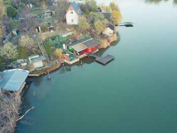 High angle view of houses by lake