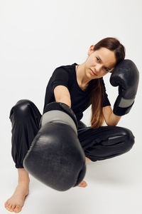 Young woman exercising in gym