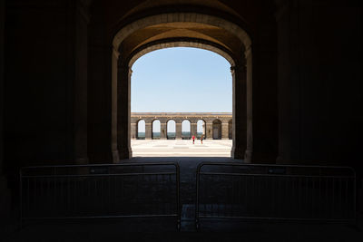 Buildings seen through arch window