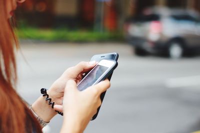 Close-up of hand holding smart phone