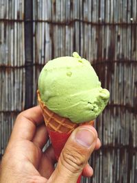 Cropped image of hand holding ice cream