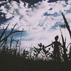 Scenic view of landscape against cloudy sky