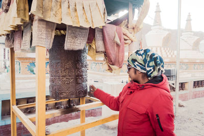 Midsection of woman standing in traditional clothing during winter