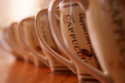 Close-up of coffee cups on table