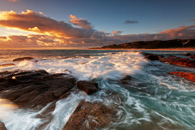 Scenic view of sea against sky during sunset