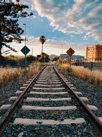 Surface level of railroad tracks against sky