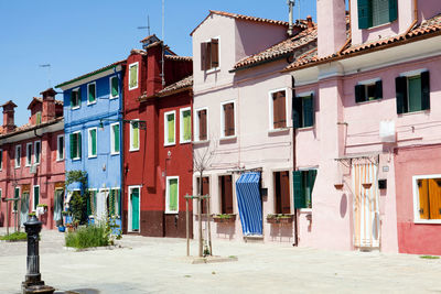 Clothes drying against buildings in city