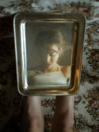 Directly above view of woman using mobile phone