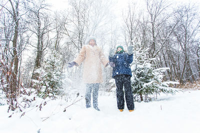 People on snow covered land