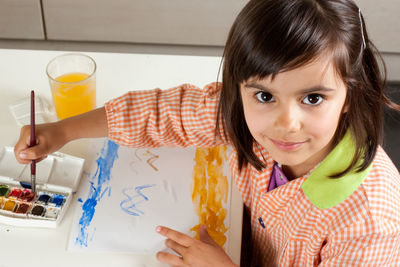 Portrait of a smiling girl holding ice cream