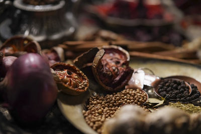 Close-up of hand with fruits on table