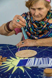 Close-up of girl drawing on table