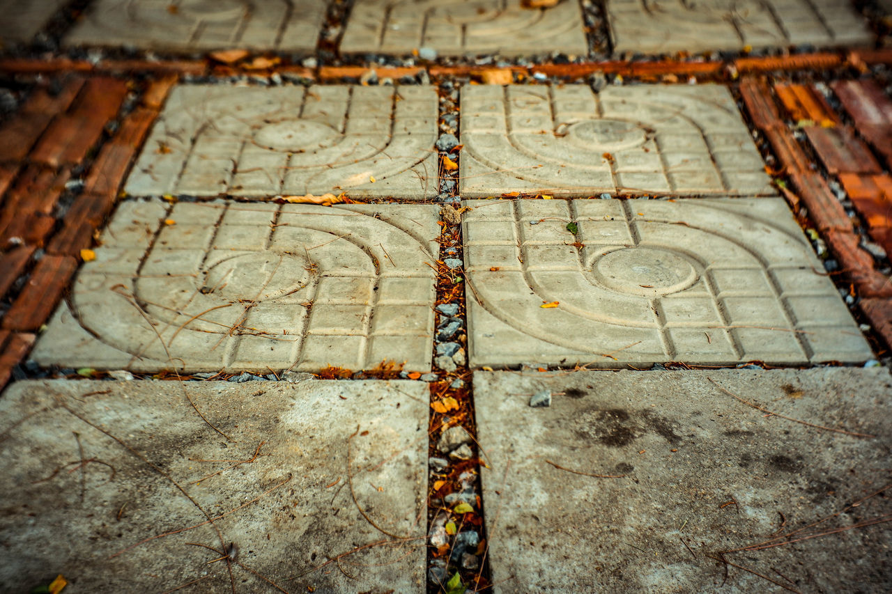 HIGH ANGLE VIEW OF TILED FLOOR WITH SHADOW ON FLOORING