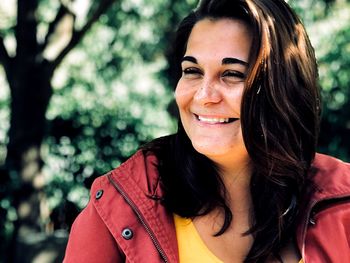 Close-up of smiling young woman outdoors