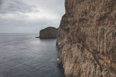 Scenic view of sea against cloudy sky