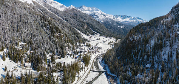 Panoramic view of snowcapped mountains against sky