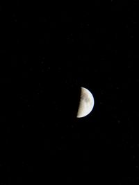 Low angle view of moon in sky at night