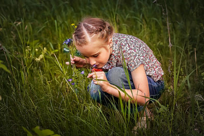 Girl looking away on field