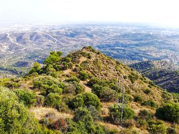High angle view of green landscape against sky