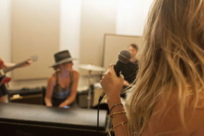 Young musicians practicing at a rehearsal space