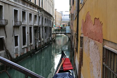 Canal amidst buildings in city