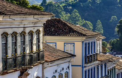 Exterior of house by buildings in town