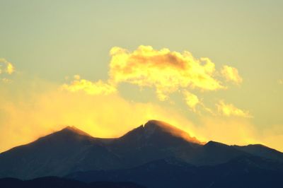 Scenic view of mountains against sky during sunset