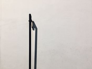 High angle view of pole against wall