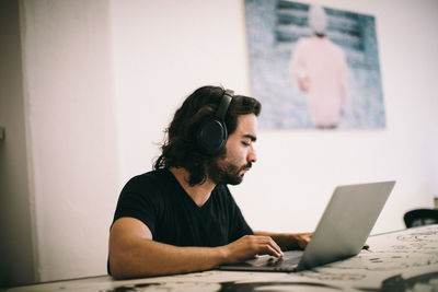 Man sitting on table at home