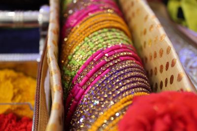 Close-up of colorful bangles for sale in box at store