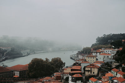 High angle view of buildings in city against sky