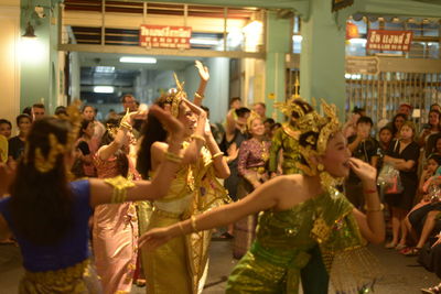 Group of people dancing at night