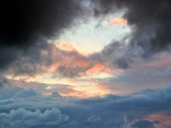 Low angle view of dramatic sky during sunset