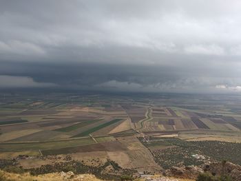 Aerial view of agricultural field against sky