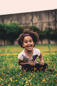 Portrait of smiling boy on field