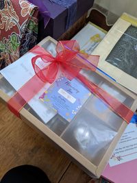 High angle view of paper in box on table