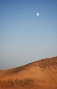 Scenic view of desert against clear sky