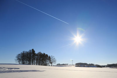 Scenic view of vapor trail against clear blue sky