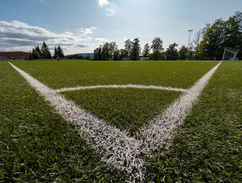 Football or soccer green grass field, detail of the corner