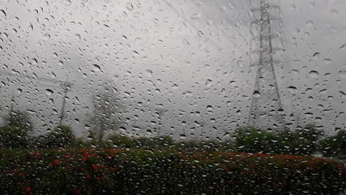 Full frame shot of wet glass window in rainy season