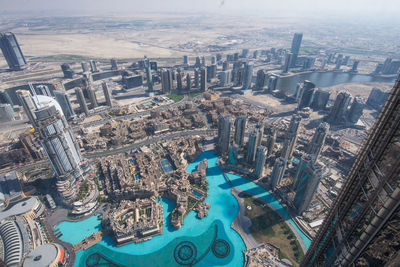 High angle view of swimming pool against buildings in city