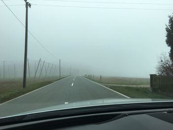 Road seen through car windshield