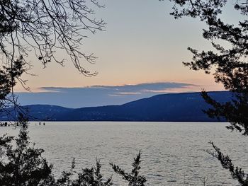 Scenic view of lake against sky during sunset