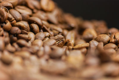 Close-up of coffee beans on table