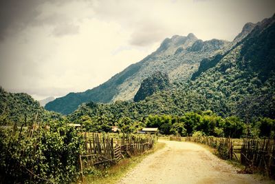 Narrow pathway along mountain range