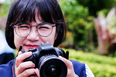 Portrait of woman photographing