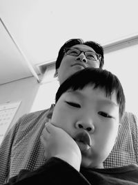 Close-up of father with baby at home