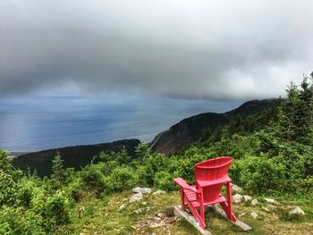 Scenic view of sea and mountains against sky